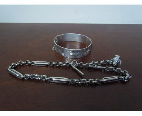 A silver stiff hinge bangle with engraved foliate half-surround together with a 'Mexican silver' watch chain 