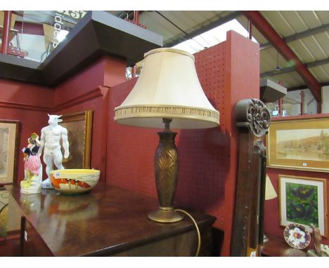 A bronzed table lamp base with arched foliate design, together with a gold coloured silk shade 