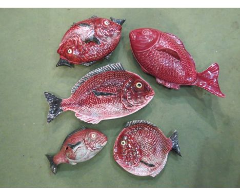 A collection of ceramic fish design tureens, plates and dishes