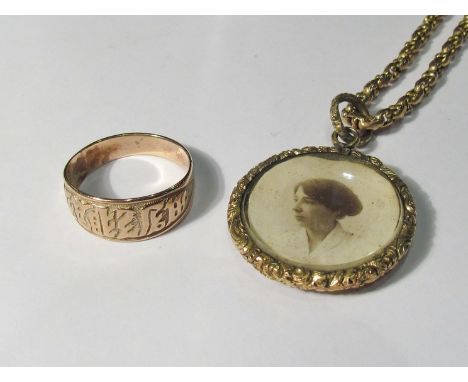 A gold plated oval photograph locket on a chain and a gold plated ring (2)