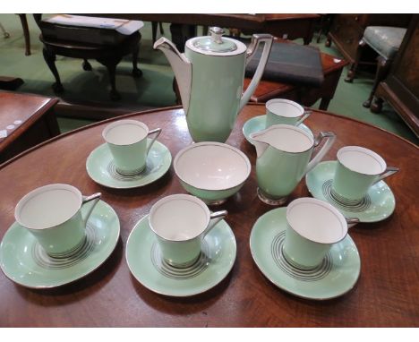 A Royal Doulton Art Deco coffee set comprising of coffee pot, six coffee cans and saucers, cream jug and sucrier, all mint an