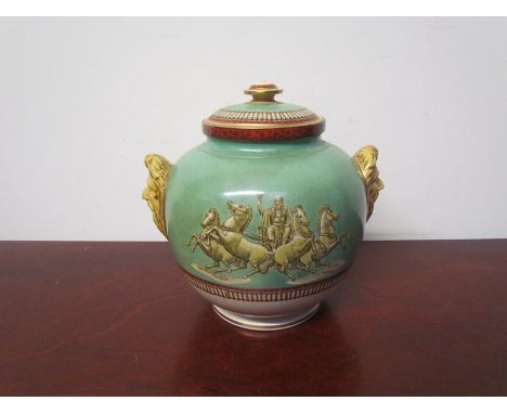 A Circa 1861 Victorian Prattware lidded pot with mask handles and mythological images, 21cm tall