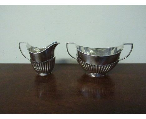 A William Hutton & Sons silver milk jug and sugar bowl, London 1987, 131g