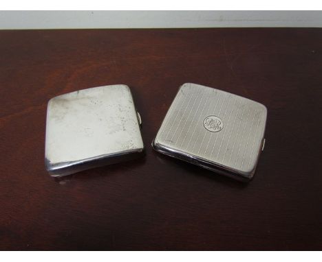Two silver cigarette cases, one with engine turned detail, and a silver candlestick a/f, 204g