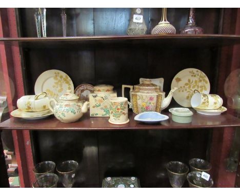 A selection of ceramics including cream ground and gilt embellished tea cups and saucers, floral design teapots etc
