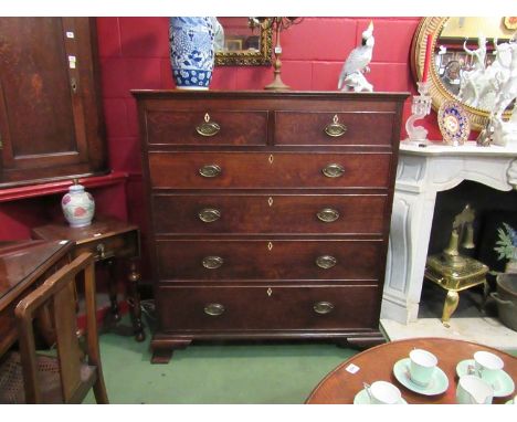 A George III oak country house chest of two short over four graduating long drawers with bone key escutcheons on bracket feet