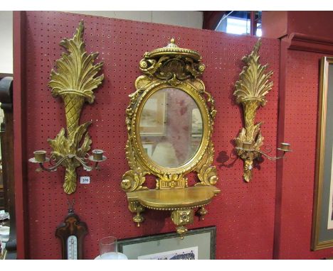 A gilded mirrored wall bracket 