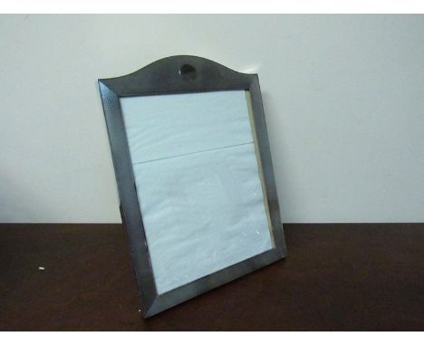 A large silver photo frame with engine turned front decoration and vacant cartouche, marks rubbed