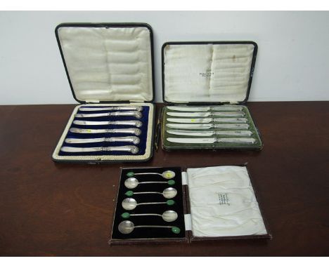Cased flatware including coffee bean spoons, silver handled knives 