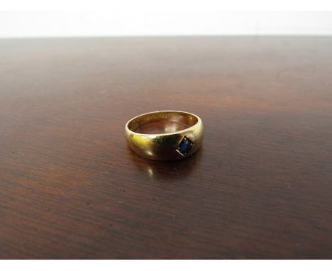 An 18ct gold ring set with central illusion set sapphire 