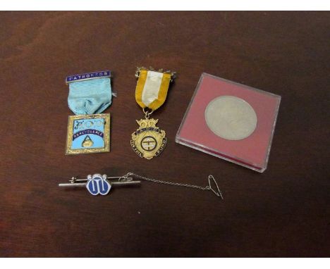 A 9ct gold and enamel Masonic medal, a silver gilt example and silver/enamel bar brooch, together with a commemorative crown 