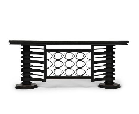 IN THE MANNER OF RAYMOND SUBES A PAIR OF ART DECO CONSOLES; CIRCA 1930 Patinated wrought iron, openwork design, with black ve