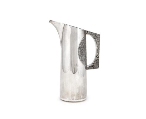 STUART DEVLIN (AUSTRALIAN, 1931-2018) CLARET JUG; 1971  Silver, with Filigree handle and pattern matched side panel. Impresse