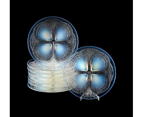 RENÉ LALIQUE (FRENCH, 1860-1945) EIGHT 'COQUILLES' PLATES; DESIGNED 1924; PRE 1945 Opalescent glass All 23.5cm diameter Signe