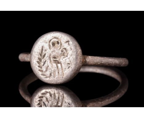 Ca. 6th-7th century AD.A silver finger ring with a circular hoop and round plate bezel bearing an image of Mary Theotokos, se