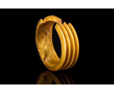 New Kingdom, 18th Dynasty - 19th Dynasty, Ca. 1550-1185 BC.A gold earring composed of four hollow sheet tubes, triangular in 