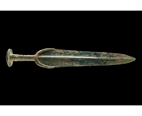 Western Asiatic/Aegan, Ca. 1200-700 BC.A bronze sword featuring a leaf-shaped blade that gracefully tapers to a sharp point. 