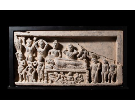 Ca. AD 200-300.A relief schist panel illustrating the Parinirvana, the death of Buddha. In this portrayal, Buddha is depicted