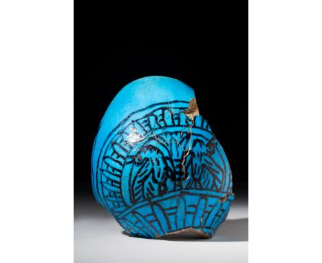 New Kingdom, 18th Dynasty, Ca. 1550 - 1295 BC.A bright blue, glazed fragment of a marsh bowl. The interior of the bowl is dec