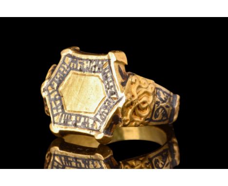 Ca. 14th-15th century AD.A gold finger ring characterised by a round hoop and expanding shoulders, adorned with intricate low