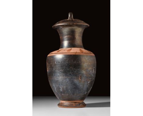 Magna Graecia, Ca. 350 BC.A pottery amphora featuring a bail-type handle with an applied attachment loop at the top centre. B