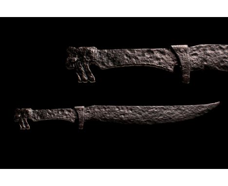 Eastern Steppes, Southern Europe, Ca. 9th - 11th century AD.A long example of a hand forged iron dagger featuring a curved bl