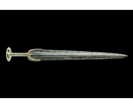 Western Asiatic/Aegan, Ca. 1200-700 BC.A double-edged bronze sword with a sharp blade that tapers to a pointed end, complemen