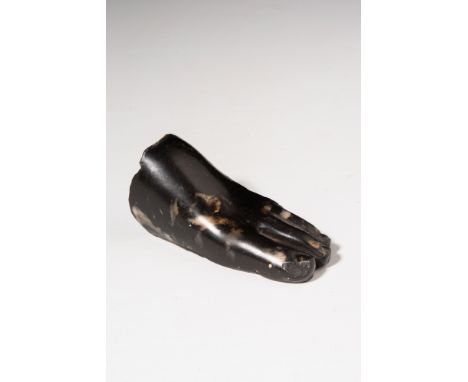 Ptolemaic Period, Ca. 380 - 30 BC.A basalt left foot fragment from a statuette, naturalistically carved with detailed toenail