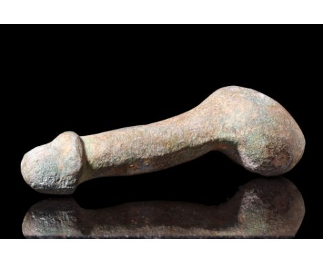 Ca. AD 100-300.A bronze amulet fashioned in the form of a phallus, crafted with testicles and well-defined glans. The phallus