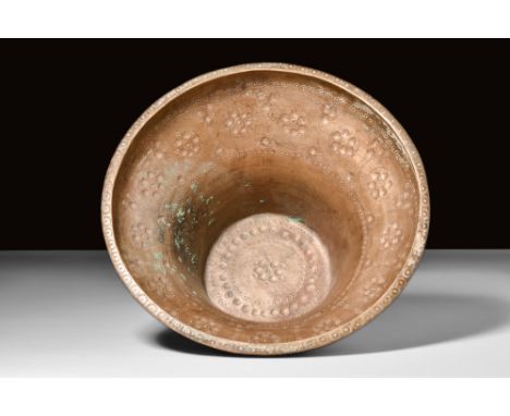 Ca. AD 224-651.A bronze vessel, characterised by a flat and circular bottom. It ascends through a tubular lower body to a gen