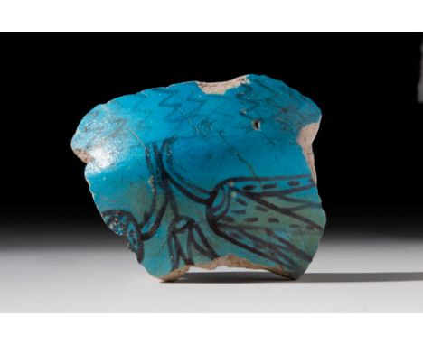 New Kingdom, 18th Dynasty, Ca. 1550 - 1295 BC.A faience bowl fragment with a stunning colour and shape. The vessel is adorned