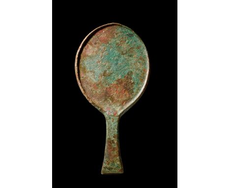 Ca. 400 BC.A bronze mirror cast in one piece. It features an ovoid-shaped body with a raised border and a flat-section flarin