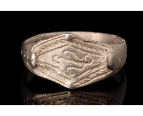 Viking Era, Ca. AD 900-1100.A finger ring crafted from silver, featuring a flat-sectioned round hoop that gently expands to c