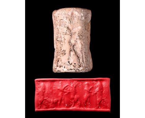 Ca. 2400-2200 BC. A plaster cylinder seal depicting mythical bullmen fighting lions. An inscription in Old Akkadian or Sumeri
