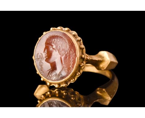 Ca. AD 100-300.A red stone intaglio engraved with a left-facing portrait of Mercury (Greek Hermes), the god of communication,