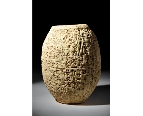 Ca. 1900 BC.A beautiful example of a clay barrel cylinder of biconical form, with hollow interior. Cuneiform barrel cylinders