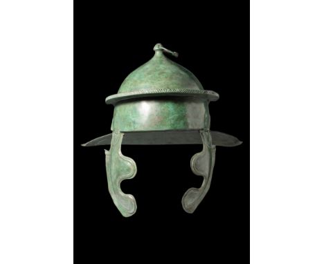 Ca. AD 100-200. A bronze helmet with a round skull, topped with a small mushroom-shaped knob (peak) and a modern suspension r