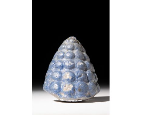 New Kingdom, Ca. 1550 - 1069 BC.A deep blue faience inlay of a cluster of grapes; This form of grape cluster were used as arc