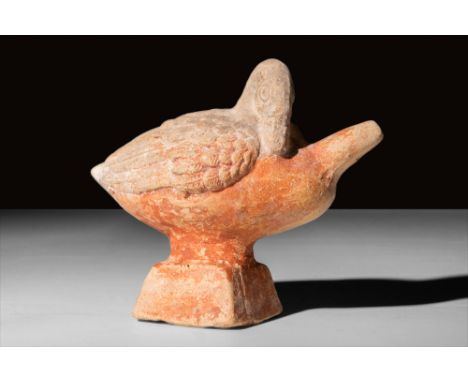 Ca. 1st-4th Century AD.An adorable pottery baby feeder in the form of a swan with meticulously detailed plumage along its tuc
