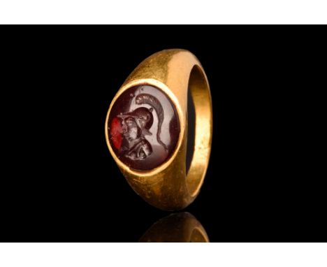 Ca. AD 100-300.A gold finger ring of Guiraud type 2c, composed of a round hoop with a tapering profile and a circular intagli