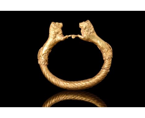 Ca. 4th century BC.A gold bracelet featuring a hollow round body with applied ropework, which creates a mesmerising faux-twis