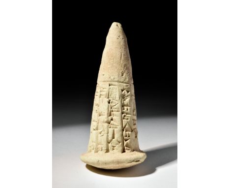 Ca. 2000 BC .An Old Babylonian foundation cone ‘clay nail’ with cuneiform round roughly two-thirds of the body. The body tape
