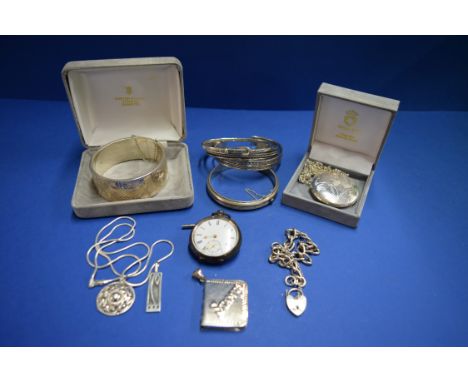 A large silver cuff bangle; together with a large silver locket; a collection of similar silver items of jewellery; and a poc