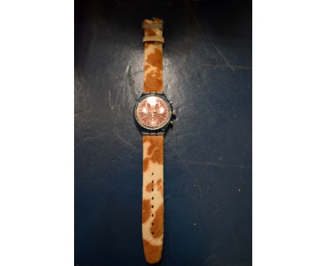 A boxed Swatch Chronograph watch with cow hide strap.   Condition Report:  Unused condition