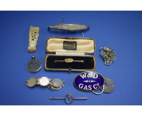 A 9ct gold naval bar brooch; together with a silver filigree gondola; a Wandsworth and District enamel cap badge; a carved mo