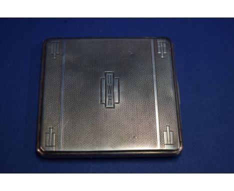 An engine turned silver cigarette case, 100g approximately.