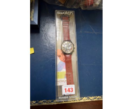 A boxed Swatch Chronograph A406 watch on leather strap..   Condition Report:  Unused condition