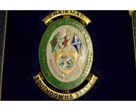 A silver gilt and enamel insignia for The National Association of Licensed House Managers.