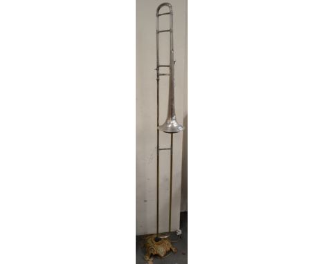 Unique standard lamp made for the Steampunk fashion market made from a trombone upon cast iron stand, height 77"