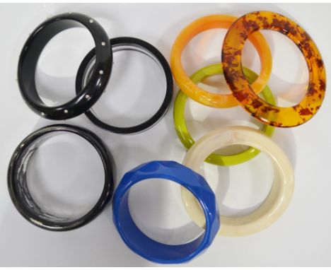 Eight vintage plastic bangles